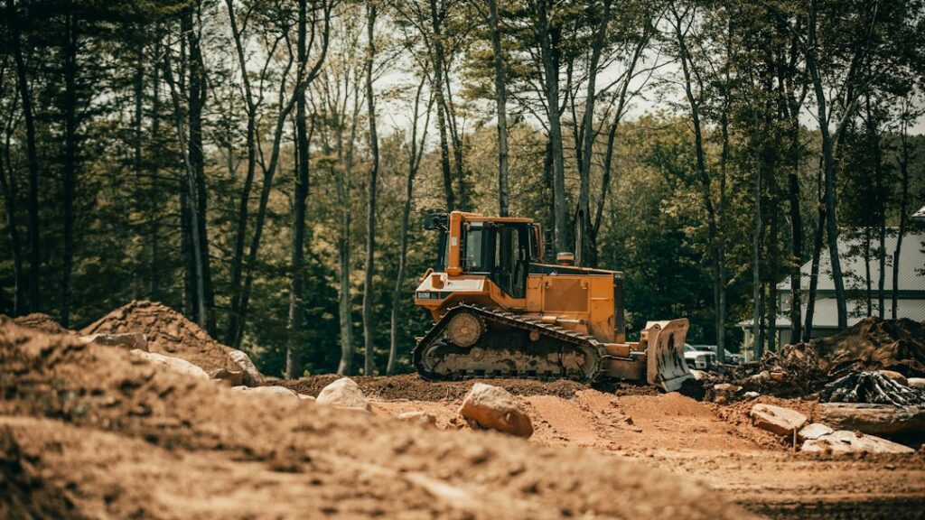 Heavy construction equipment operating at an outdoor construction site
